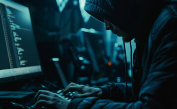 Closeup of a hacker working on a computer, dark environment, emphasizing code and security breach, cybernetic tone, Monochromatic Color Scheme